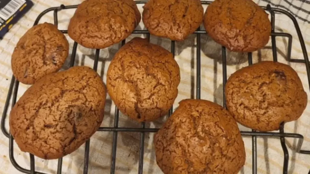 Delicious orange cookies on a baking tray, looking inviting and tasty. Learn how to make perfect orange cookies with our step-by-step guide