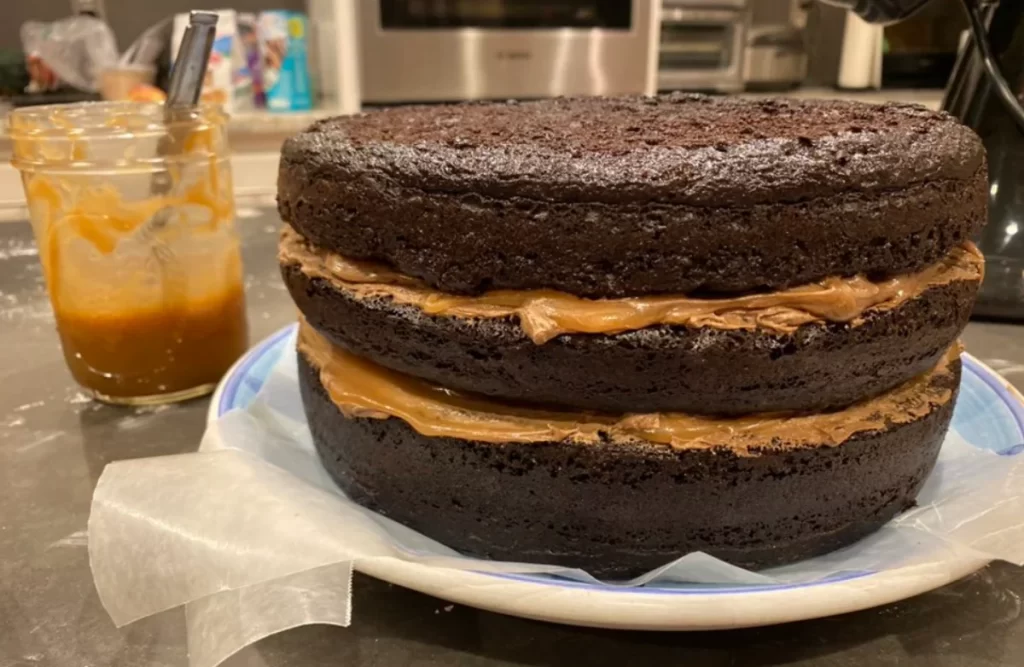 Close-up of Sweet Delight Caramel Chocolate Cake with layers of rich chocolate and gooey caramel, topped with a sprinkle of sea salt.