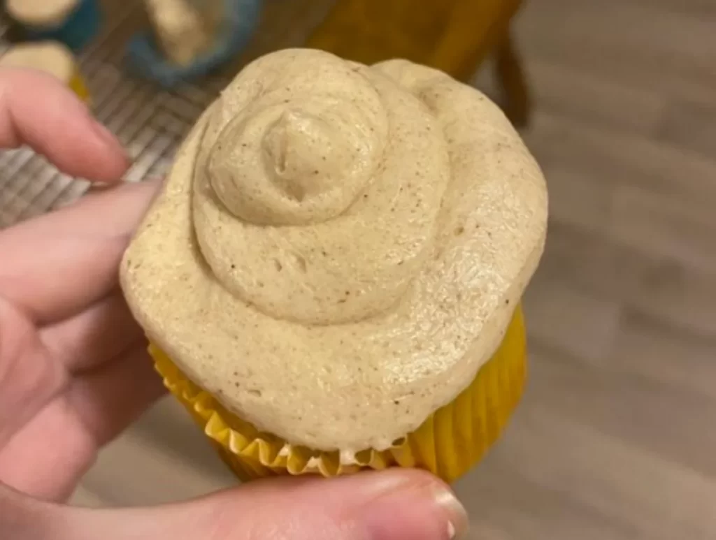 Freshly baked Apple Cider Cupcakes topped with creamy Brown Sugar Cinnamon Buttercream