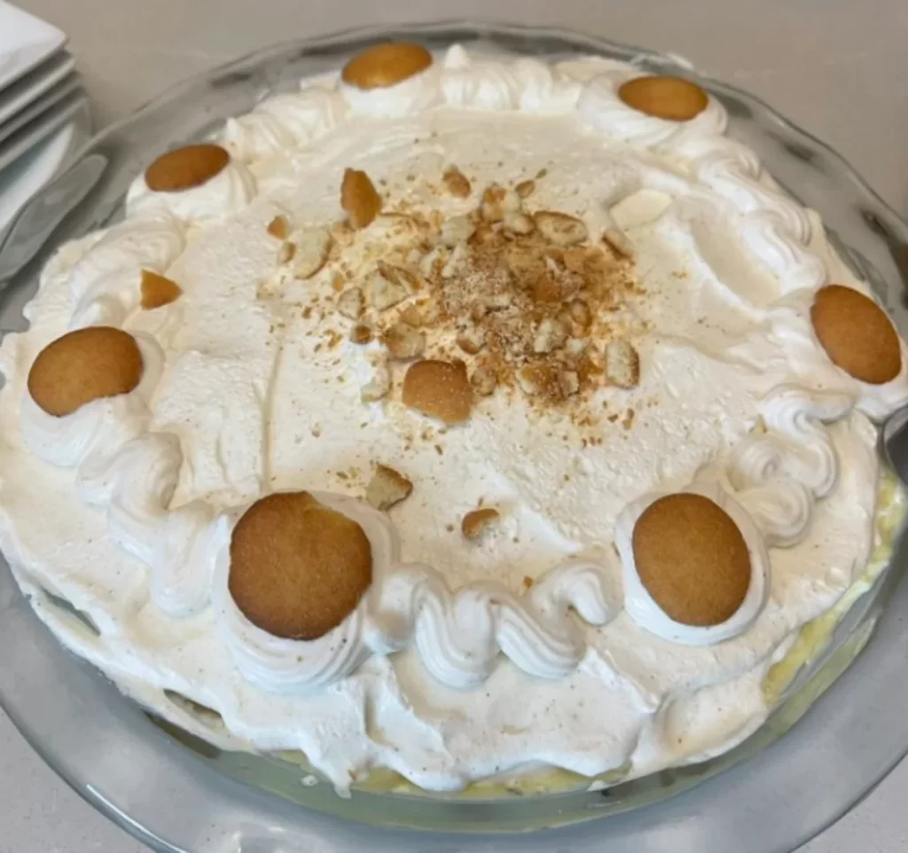 Delicious Caramelized Banana Pudding served in a bowl with vanilla wafers.