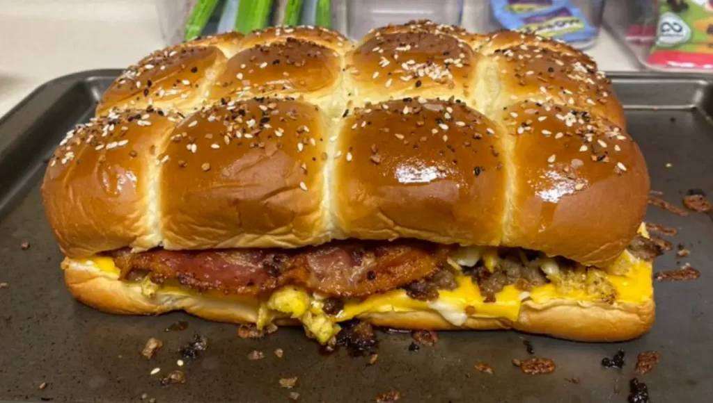 Delicious Hawaiian Roll Breakfast Sliders with eggs, cheese, and meat on a baking tray, ready to serve for a tasty meal.