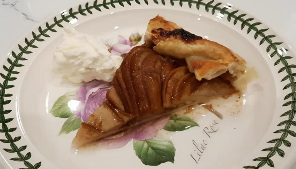 Delicious pear galette on a white plate with a golden brown crust