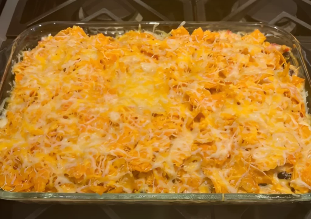 Delicious and creamy Doritos Chicken Cheese Casserole served in a baking dish, perfect for family dinners.