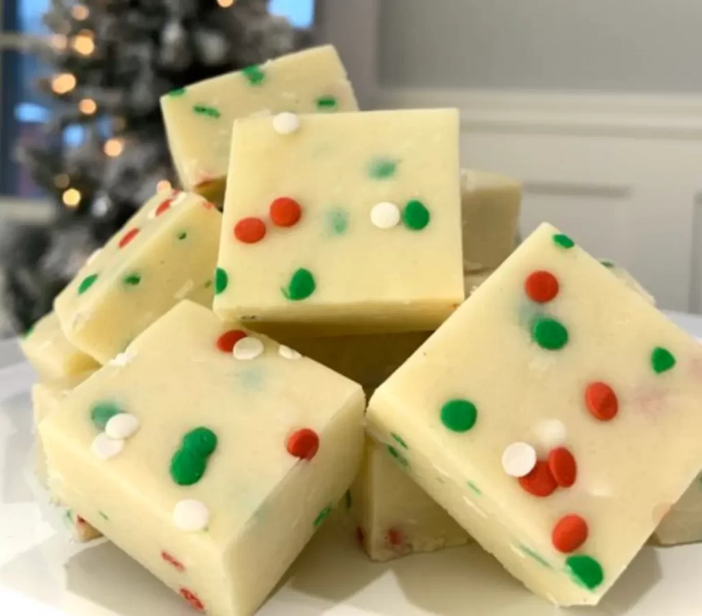 Festive Christmas Cookie Fudge with red and green sprinkles and white dots on top, ready for holiday celebrations.