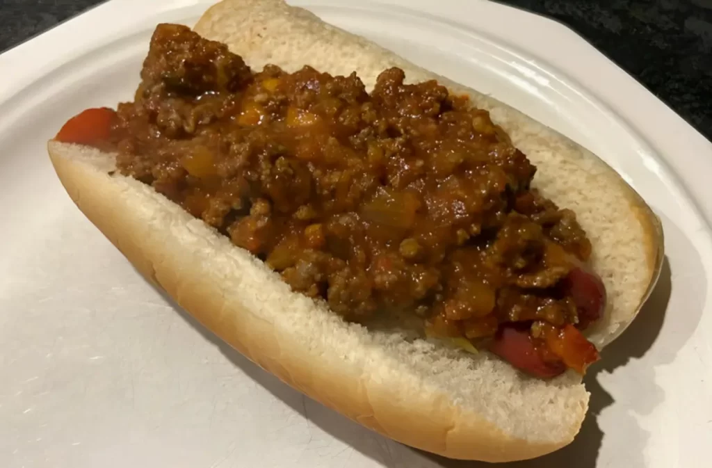 A bowl of homemade Crockpot Hot Dog Chili ready to be served on hot dogs, fries, or burgers.