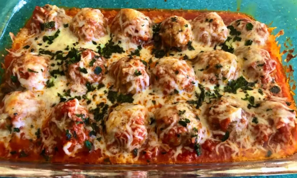 A delicious Keto Meatball Casserole with seasoned meatballs, tomato sauce, and melted cheese, perfect for a low-carb diet.