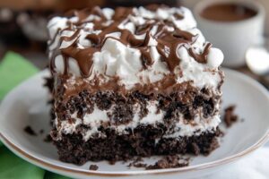 Indulge in this delicious Marshmallow Chocolate Poke Cake! This moist chocolate cake is filled with melted marshmallows and topped with rich chocolate frosting for a perfect dessert. It's easy to make and a crowd-pleaser! Don't miss out—save this pin and try this delectable recipe today!